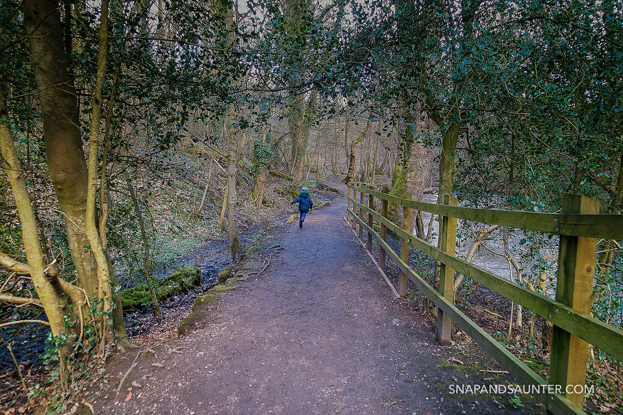 Boy running on a path at Rivelin Valley in Sheffield