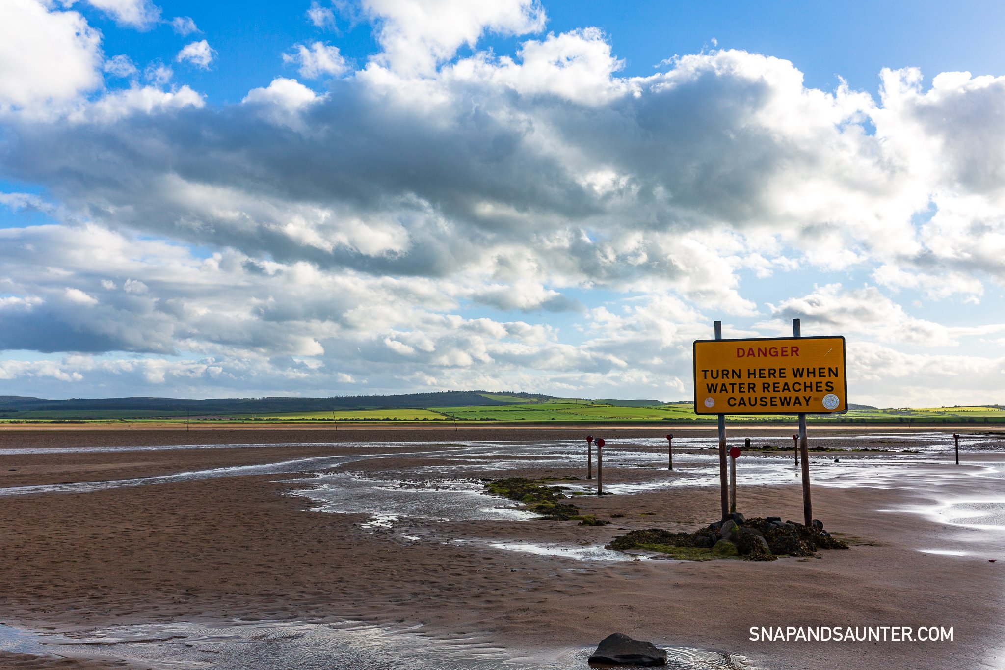 warning tidal sign at the crossing for Holy Island